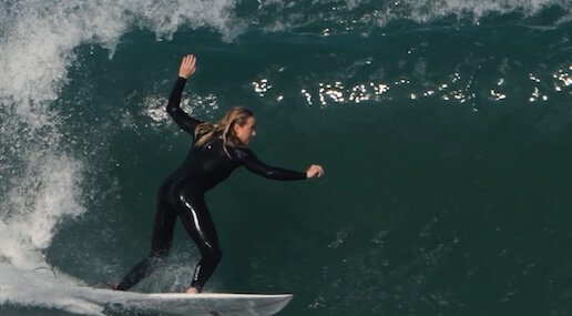 Top-down view of a surfer mastering technique during a private, tailored surf coaching session in the world-class waves of Peniche, Portugal.