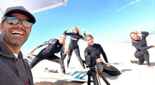 Elite surf coach Filipe Anjos with a group of students on the beach during an intensive 3-day technical coaching program in Peniche.
