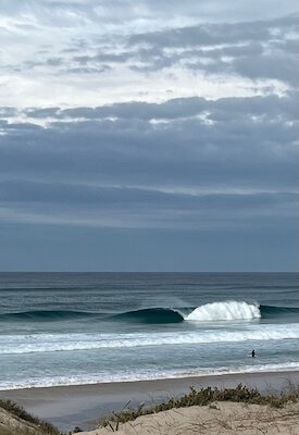 A clean, peeling empty wave at a premium surf spot in Peniche, Portugal, showcasing the ideal conditions for technical surf coaching sessions with Filipe Anjos.